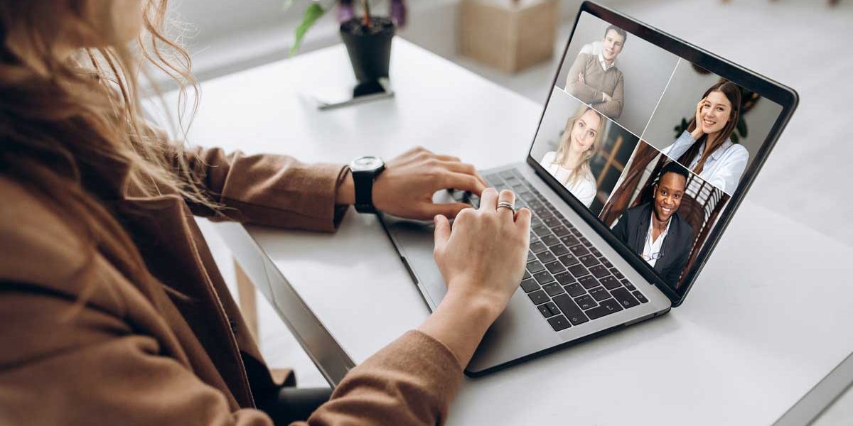 Woman communicating with team over video chat